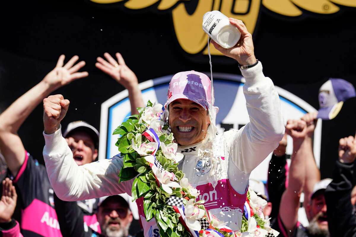 Helio Castroneves of Brazil celebrates after winning the Indianapolis 500 auto race at Indianapolis Motor Speedway in Indianapolis, Sunday, May 30, 2021. (AP Photo/Michael Conroy)