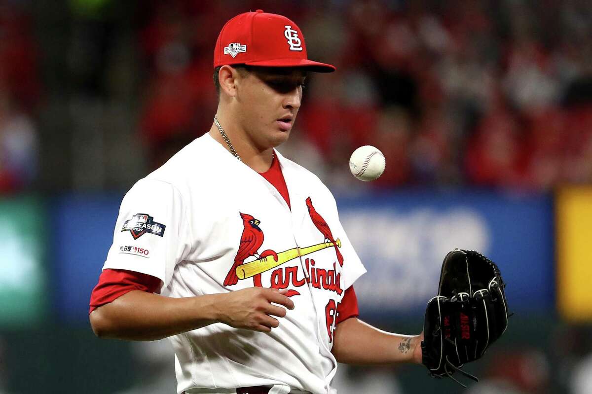 ST LOUIS, MISSOURI - OCTOBER 11: Giovanny Gallegos #65 of the St. Louis Cardinals pitches against the Washington Nationals during the seventh inning in game one of the National League Championship Series at Busch Stadium on October 11, 2019 in St Louis, Missouri. (Photo by Jamie Squire/Getty Images)