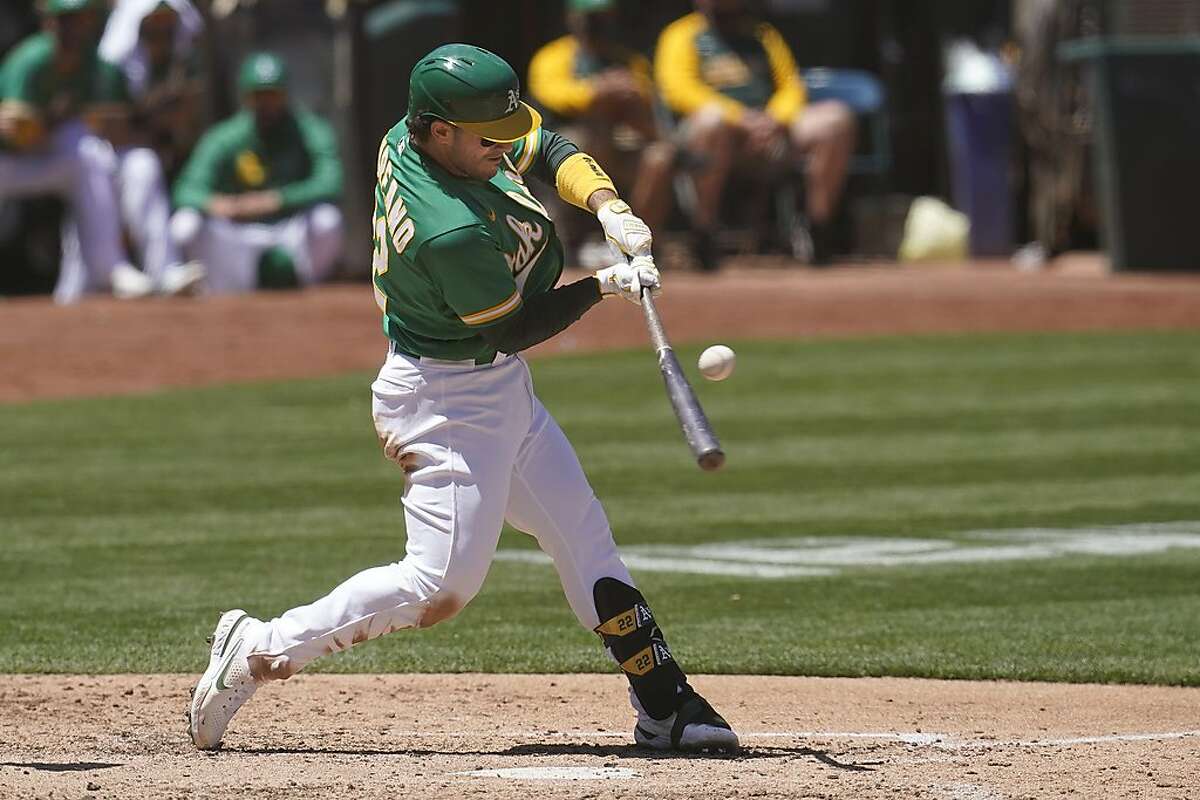 Oakland Athletics' Ramon Laureano hits an RBI-single against the Seattle Mariners during the fourth inning of a baseball game in Oakland, Calif., Wednesday, May 26, 2021. (AP Photo/Jeff Chiu)