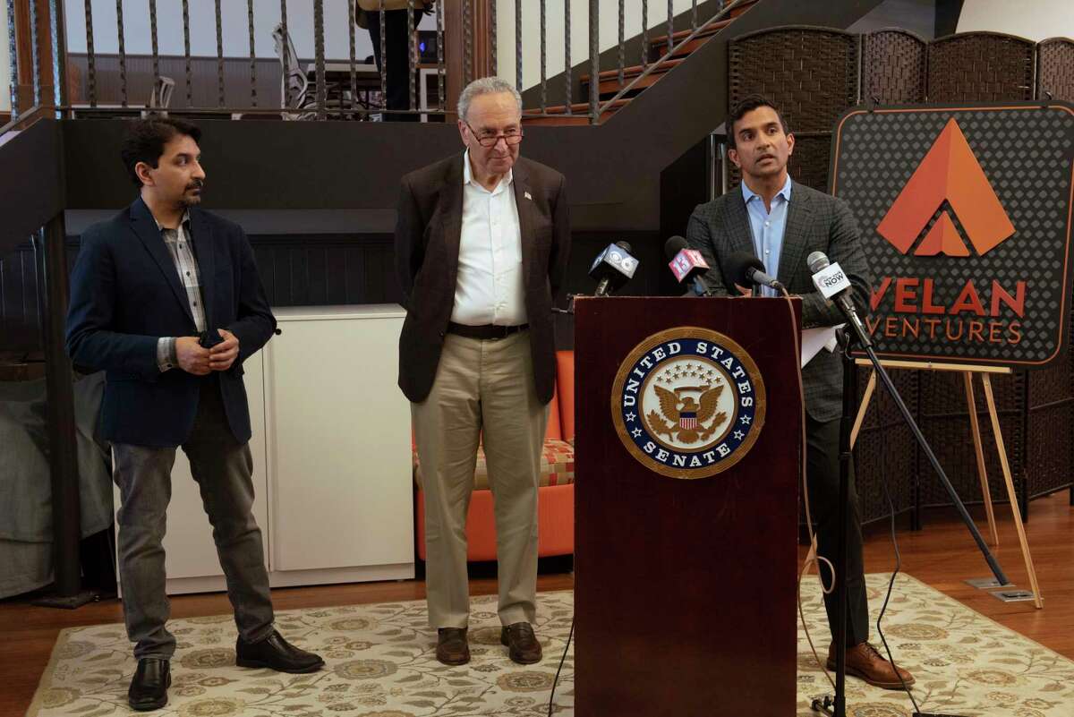 Velan Studios co-founder Guha Bala, right, speaks during a press conference with his brother and co-founder Karthik Bala, left, and U.S. Senate Majority Leader Chuck Schumer during the senator’s visit to Velan Studios in June. Guha is scheduled to be a keynote speaker at the New York State Innovation Summit in November at the Turning Stone Casino. (Lori Van Buren/Times Union)