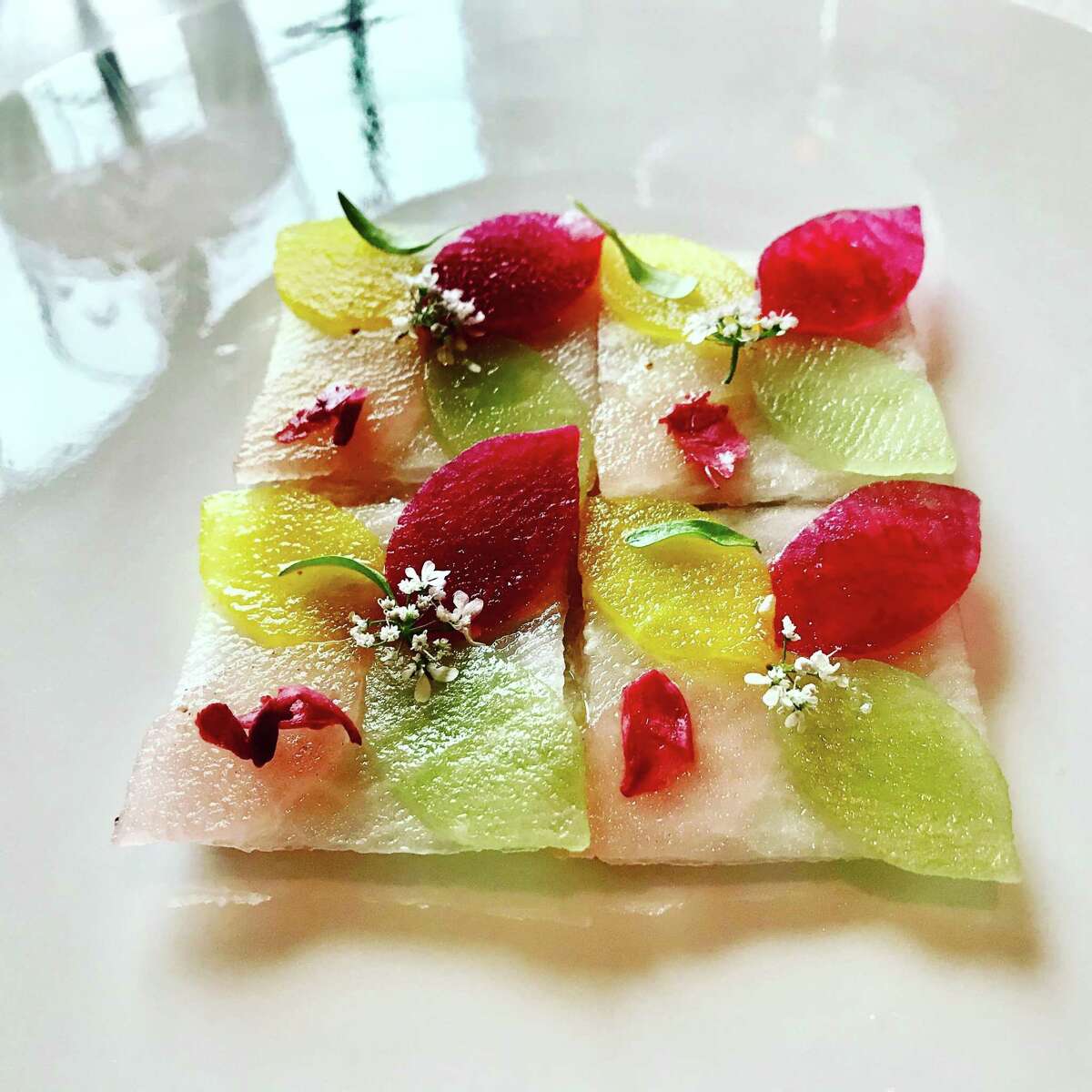 Amberjack crudo with chermoula, radish, pickled rose and apple