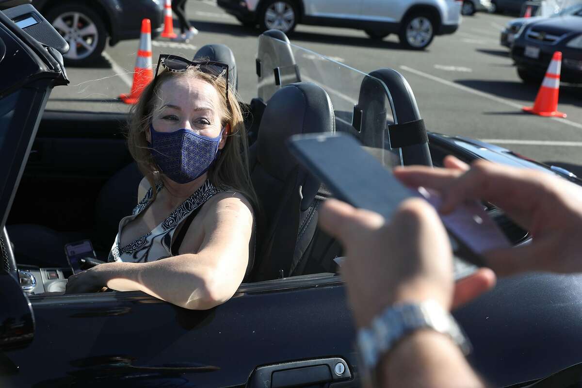 Kristina Skierka of Lucas Valley makes an appointment to complete her two-dose vaccination at Larkspur Ferry Terminal.