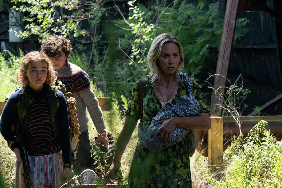 Millicent Simmonds (from left), Noah Jupe and Emily Blunt brave the unknown in "A Quiet Place Part II." (Jonny Cournoyer/Paramount Pictures/TNS)
