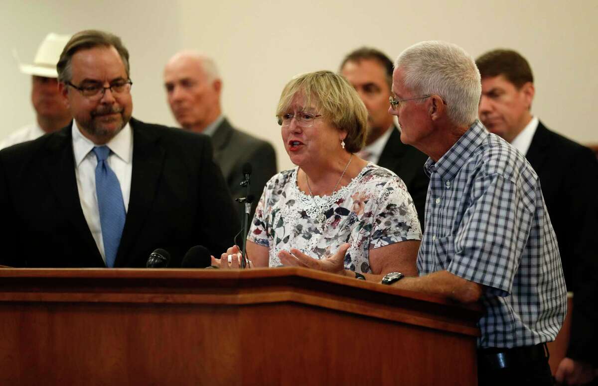 Gay Smither with her husband, Bob, speak during a press conference held by Galveston County DA Jack Roady, to make an announcement in the William Reece investigation, Saturday, Jan. 1, 2016 in Galveston. Reece led investigators to the remains of two of his victims before being transferred to Oklahoma to face a murder charge. ( Karen Warren / Houston Chronicle )