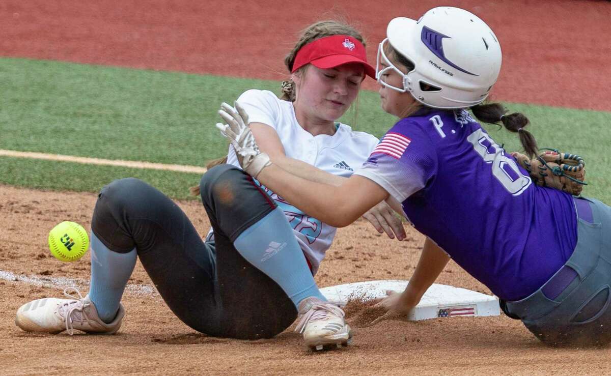 D'Hanis runner Peyton Burrell slides safely into third base Tuesday, June 1, 2021, at the UT Austin softball field after colliding with Gail Borden County third baseman Haddie Flanigan, who dropped the ball during the collision, during the Division 1A state semifinal game.