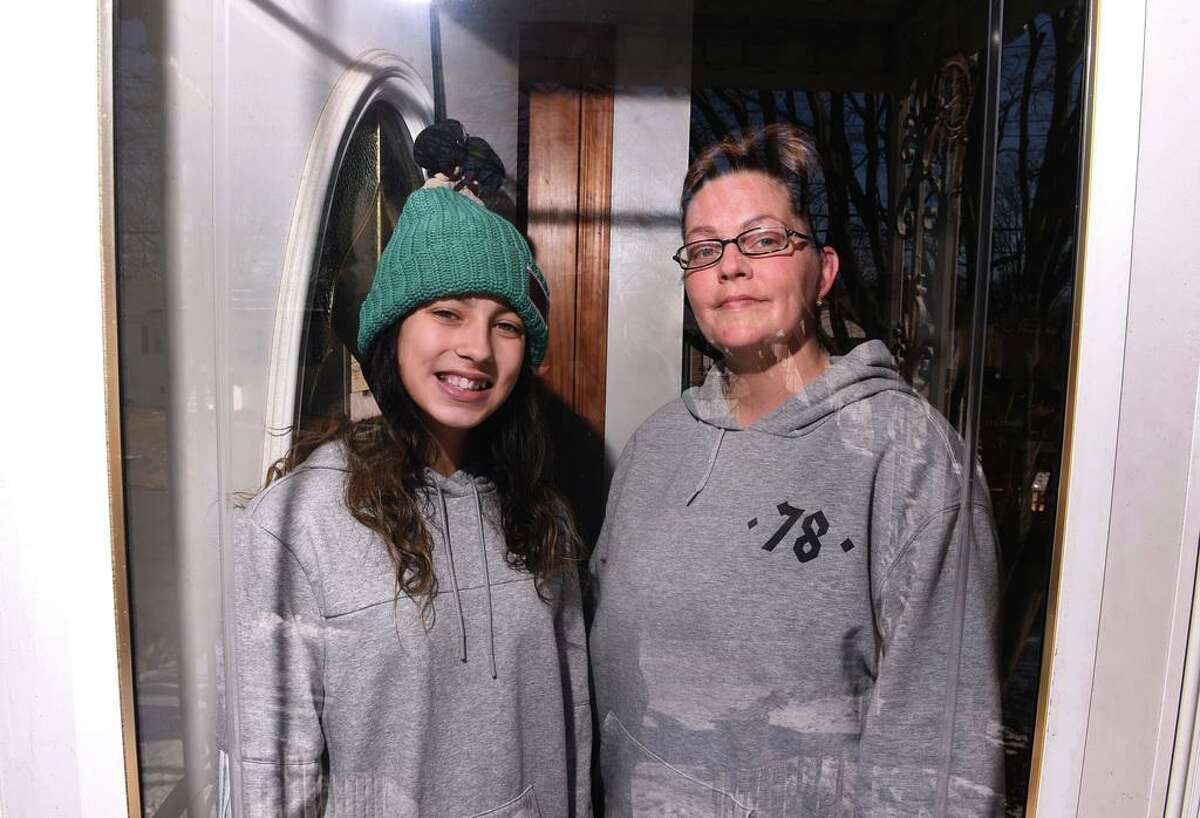 Madison Cicarella (left), 13, and her mother, Nikki Stancarone, are photographed at their home in West Haven on January 28, 2021.