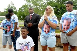 Taylor Osborn becomes emotional as she talks about the loss of her 6-year-old so Carter Osborn as family, including (from left) aunt Candice Mygrants, father Dion Roberts and brothers Bentlee Roberts and Brennan White gather at Tyrrell Park for a press conferece with Quanell X,  leader of the New Black Panthers Nation in America, who is helping the family as they seek justice for Carter. Carter Osborn was killed May 8, in Tyrrell Park after being struck by an ATV. The family says they want  justice, annd arre upset about the lack of action so far taken by Beaumont Police. The man responsible was arrested onn outstanding warrants, and no sobriety tests were issued at the scene or after to determine if alcohol or any illegal substances were involved in the accident. He has yet to be charged in Carter's death. 
Photo made Tuesday,  June 1, 2021
Kim Brent/The Enterprise