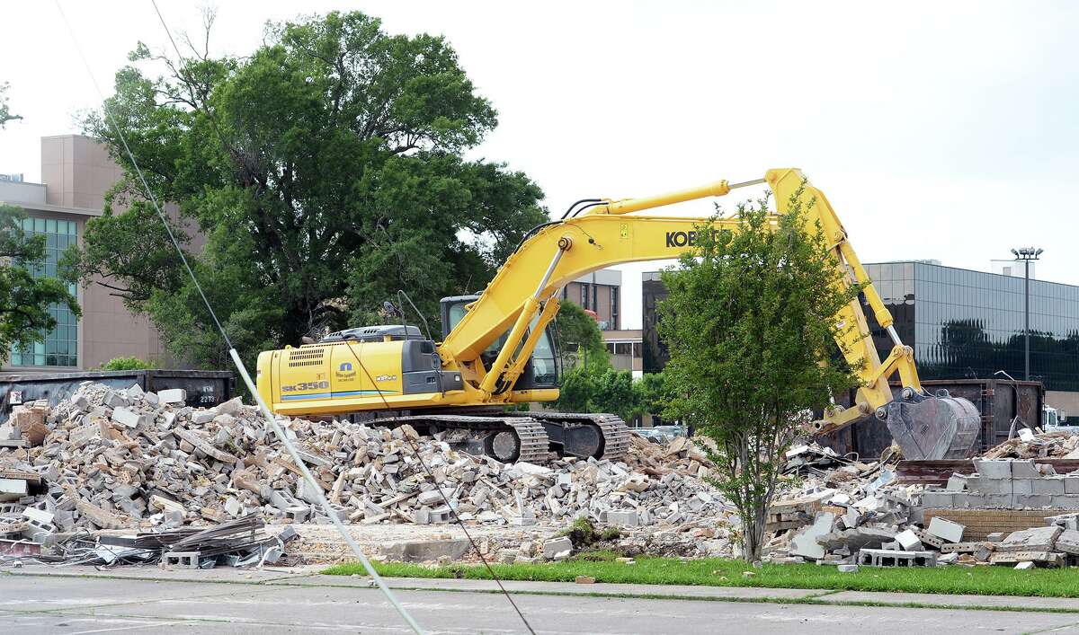 Construction crews begun demolition of the old Texas National Guard Armory on College Street to make way for the new Public Health Department building. Photo taken Wednesday, 4/23/14 Jake Daniels/@JakeD_in_SETX