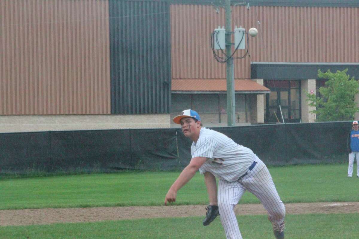 Evart's Mac Sims delivers a pitch against Reed City on Thursday. (Pioneer photo/John Raffel)