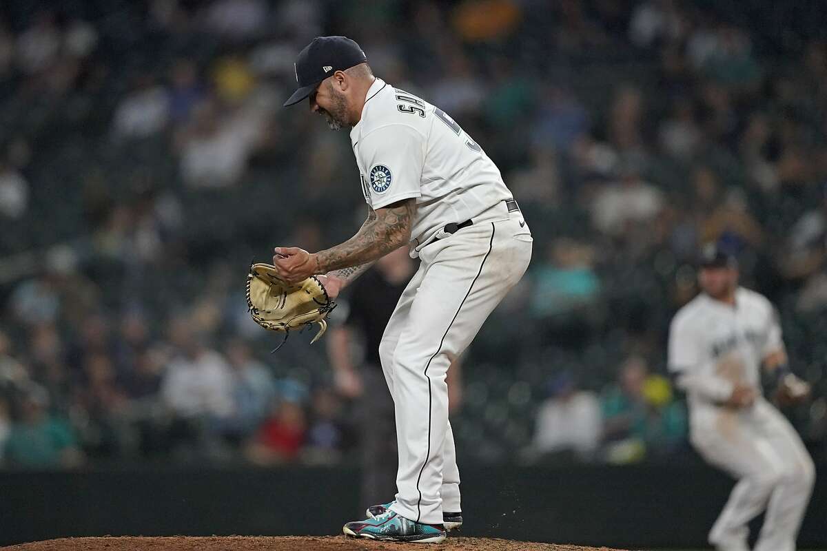 Seattle Mariners pitcher Hector Santiago reacts on the mound during the seventh inning of the team's baseball game against the Oakland Athletics, Tuesday, June 1, 2021, in Seattle. (AP Photo/Ted S. Warren)