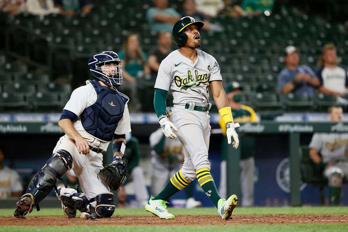 SEATTLE, WASHINGTON - JUNE 01: Tony Kemp #5 of the Oakland Athletics watches his two-run home run against the Seattle Mariners during the eighth inning at T-Mobile Park on June 01, 2021 in Seattle, Washington. (Photo by Steph Chambers/Getty Images)