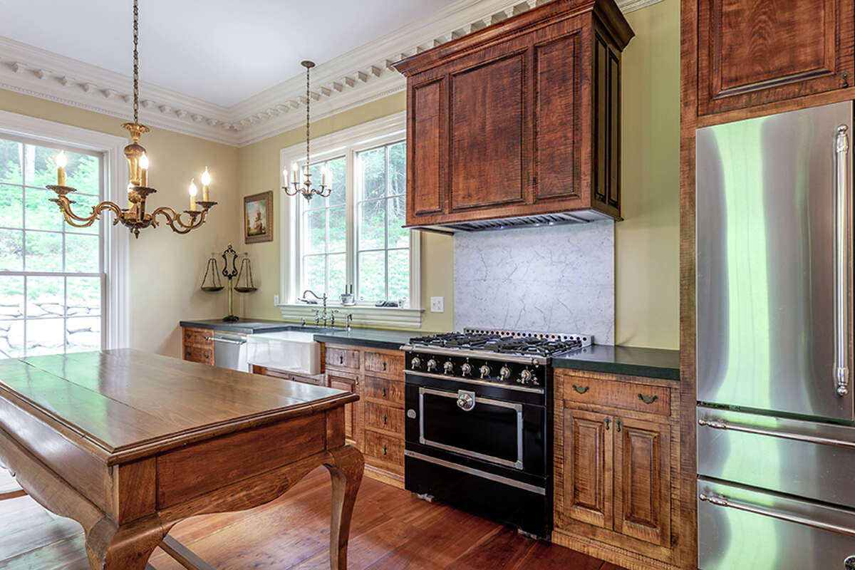 The kitchen in the home on 92 Judds Bridge Road in Roxbury, Conn. features country-style finishes, according to the listing. 