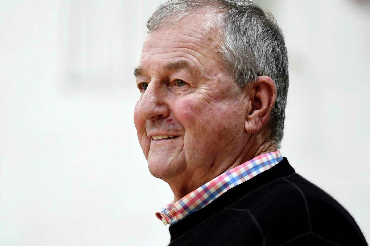 Saint Joseph coach Jim Calhoun smiles during the first half of the team's NCAA college basketball game against Pratt Institute, Friday, Jan. 10, 2020, in West Hartford, Conn. Now coaching Division III basketball with the same fire he stalked the sidelines at UConn, Calhoun is reaching his 900th win as a college coach. (AP Photo/Jessica Hill)