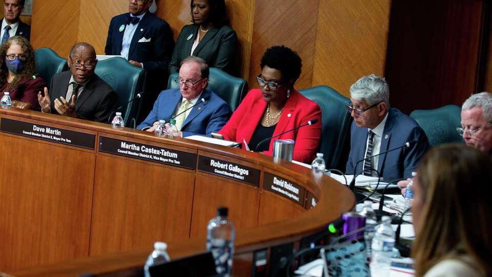 Mayor Sylvester Turner, left, talks to council members during the first in-person meeting in a year at City Hall on Wednesday, June 2, 2021, in Houston. City Council met to consider the mayor's $5.1 billion budget for the next fiscal year.