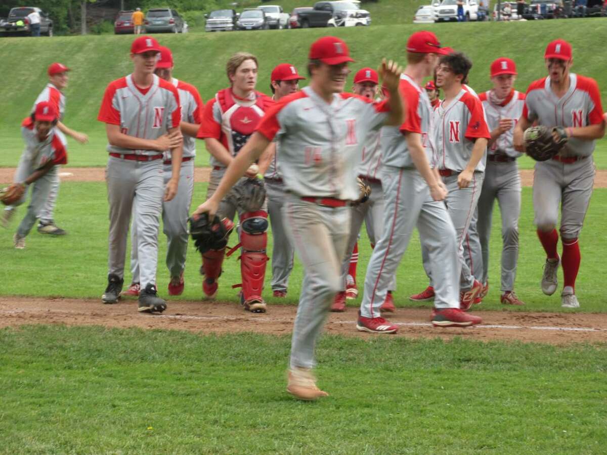 Winning pitcher Josh Hamel leads the Northwestern celebration after a win over Suffield in Class M second round Wednesday afternoon.