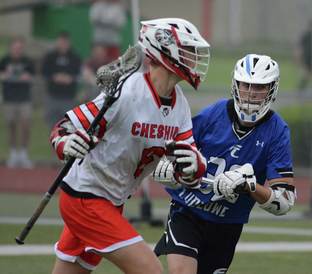 Ludlowe’s Zack Hathaway, right, defends Cheshire’s Jack Lovelace during a first-round Class L boys lacrosse game on Wednesday in Cheshire.