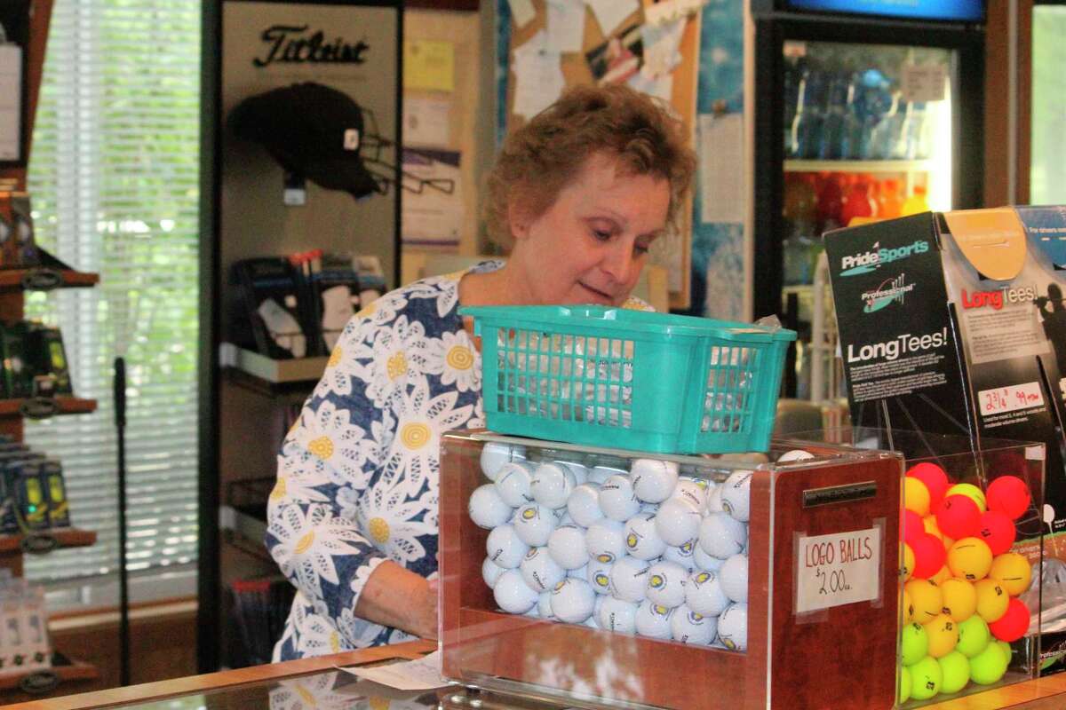 Kathy Vandonkelaar takes care of paperwork at Marquette Trails on Monday. (Star photo/John Raffel)