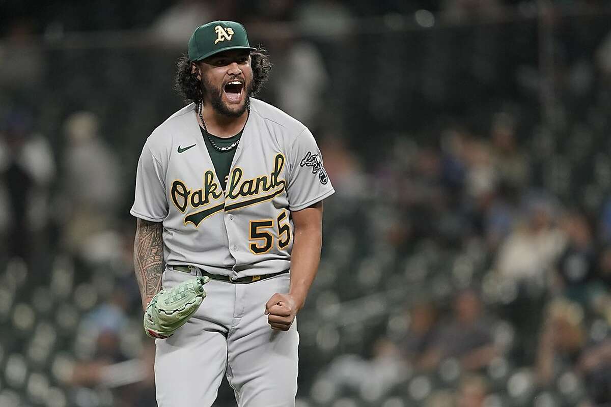 Oakland Athletics starting pitcher Sean Manaea reacts after the final out the team's baseball game against the Seattle Mariners, Wednesday, June 2, 2021, in Seattle. Manea threw a four-hitter as the A's won 6-0. (AP Photo/Ted S. Warren)