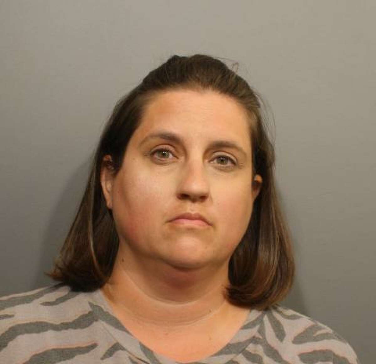 Amy Tingets, 39, of Norwalk, turned herself in last week on a warrant, charging her with first-degree assault and risk of injury to a child, police said.