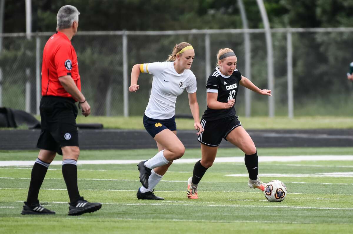 Bullock Creek's Lauren Wishowski moves the ball up field during the Lancers' game against Ovid-Elsie Wednesday, June 2, 2021 at Freeland High School. (Adam Ferman/for the Daily News)