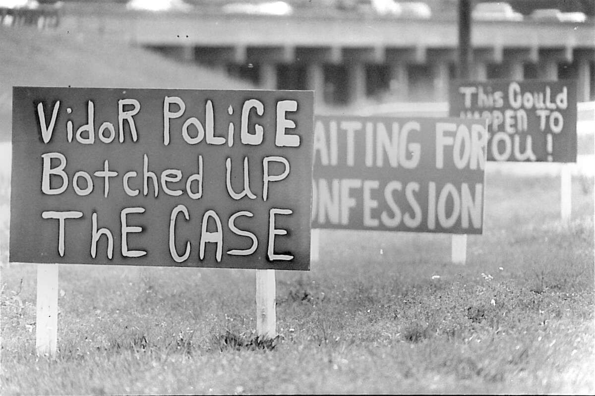 Three of several signs along Interstate 10 alleging problems with Vidor Police's investigation into the 1991 murder of Kathy Page. Photo dated April of 1994 Beaumont Enterprise archive photo