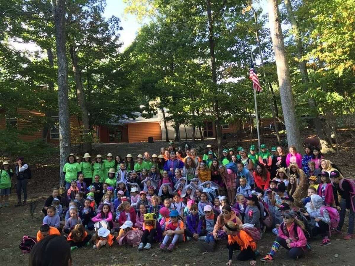 New Fairfield's Girl Scout troops gathered at Camp Candlewood annually for the weekend encampment called Camporee. Above,