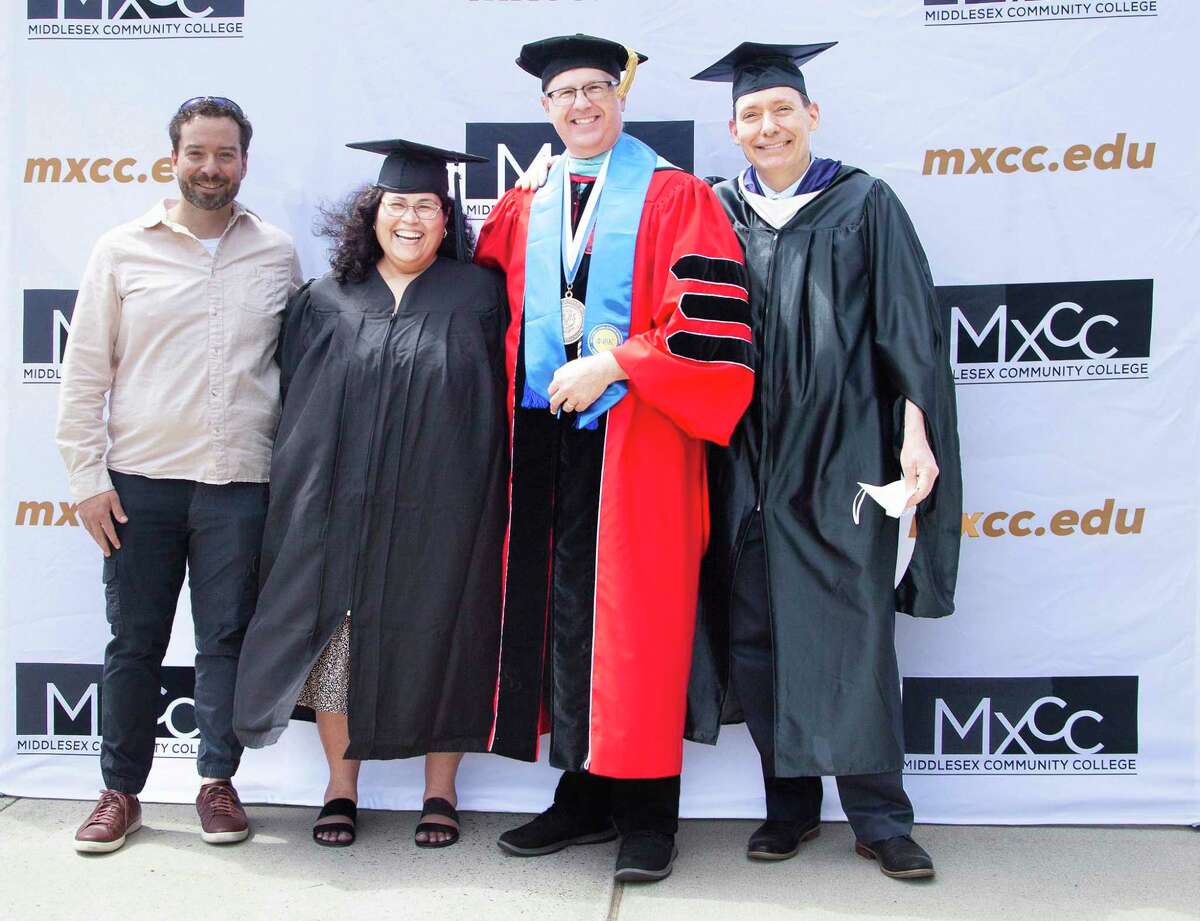 Middlesex Community College's graduation ceremony was held May 28 in Middletown. From left are Daniel McGloin of the Wesleyan University Center for Prison Education program, Marisol Garcia, CEO Steven Minkler and Professor Tad Lincoln.