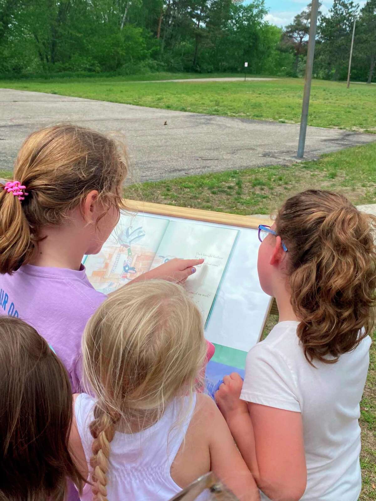 Kylene Nix, a Reed City teacher who also serves as treasurer with the RCADL, had her first-grade class from G.T. Norman Schools visit the StoryWalk in Westburg Park. (Courtesy/Kylene Nix)