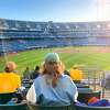 SFGATE reporter Madeline Wells watches the Oakland Athletics play against the Seattle Mariners in RingCentral Coliseum on May 25, 2021 in San Francisco, Calif.