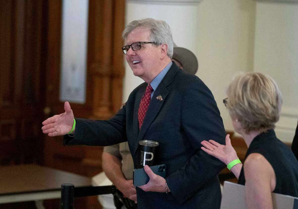 Lt. Gov. Dan Patrick leaves a meeting room outside the Senate chamber in Austin with his son-in-law Jared Scruggs (blue shirt) as the chamber works to clear a backlog of bills before Monday's end of session. (Daemmrich/CapitolPressPhoto)