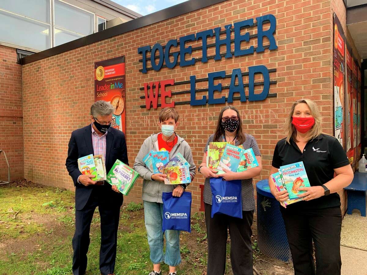 Brookside Elementary teacher Kari Rayburn (third from left) was one out of ten educators in the state of Michigan awarded a classroom library from the 2021 MEMSPA Foundation Blogging for Books Campaign. (Courtesy/Leah Lipar)