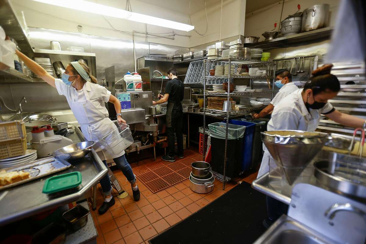 Employees say Flea Street Cafe’s service charge dissolved traditional barriers between the kitchen and servers.