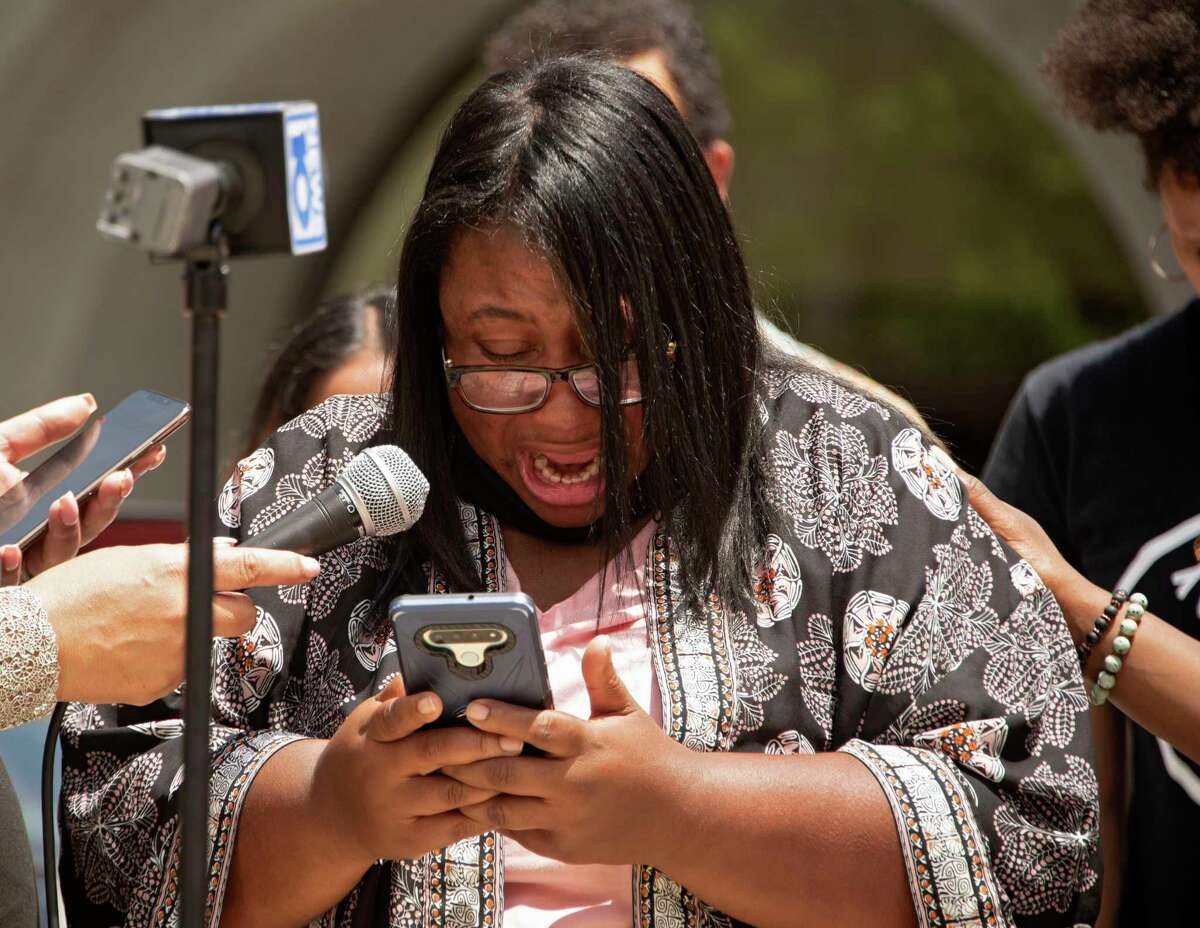 Yolanda Richardson, the mother of a girl who was allegedly abused by a bus monitor, gets emotional as she reads a statement on her phone during a press conference outside the Albany County Courthouse on Friday, June 4, 2021 in Albany, N.Y. (Lori Van Buren/Times Union)