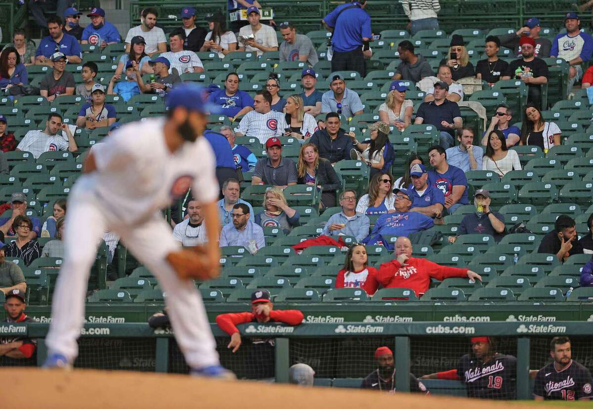 The Latest: Cubs to have full capacity at Wrigley next week