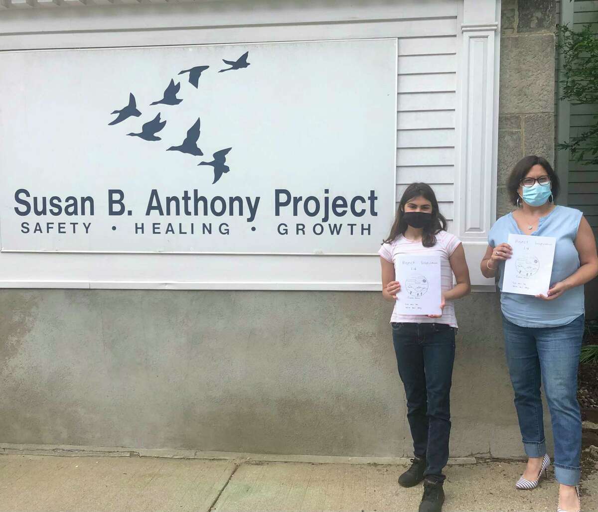 Cianna Ferraro, 13, an eighth-grader at Northwest Regional No. 7, created and donated more than 80 coloring books with uplifting messages and activities to the Susan B. Anthony Project June 4. She is pictured with Gina Devaux from Susan B. Anthony.