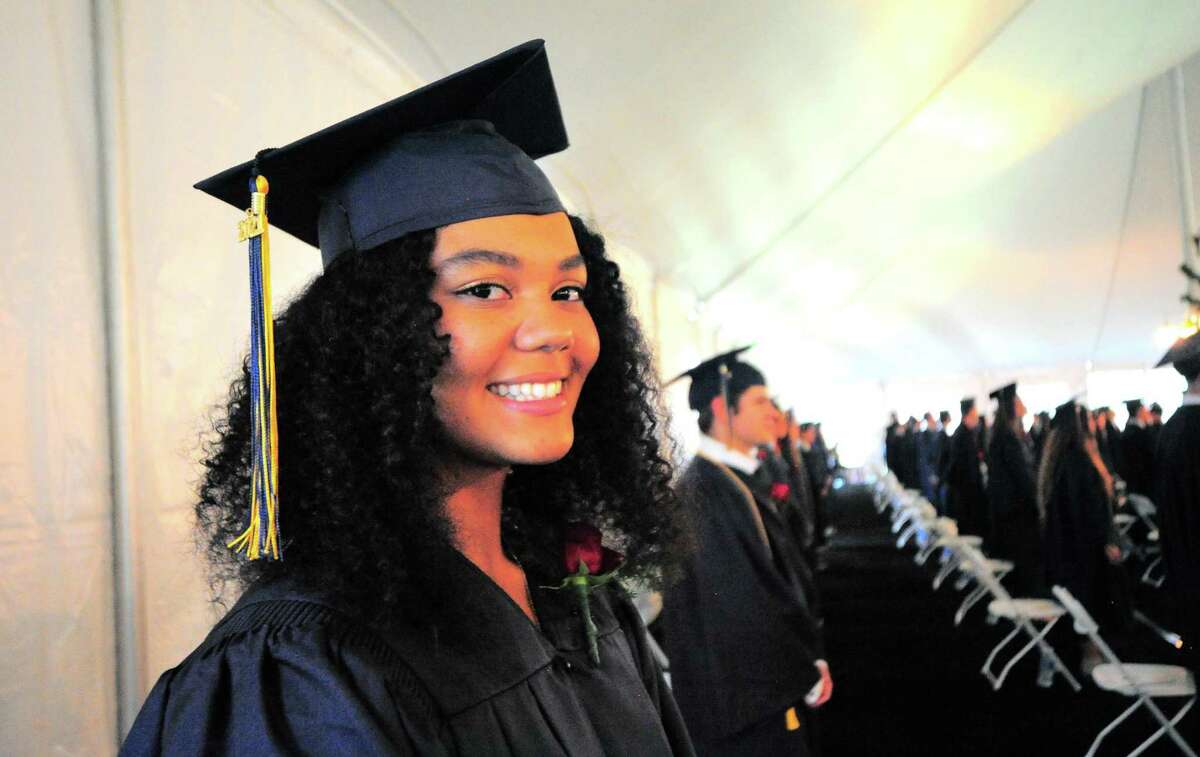 Graduate Milei Wyatt smiles for the camera at the start of King School's Commencement Exercises in Stamford, Conn., on Friday June 4, 2021.