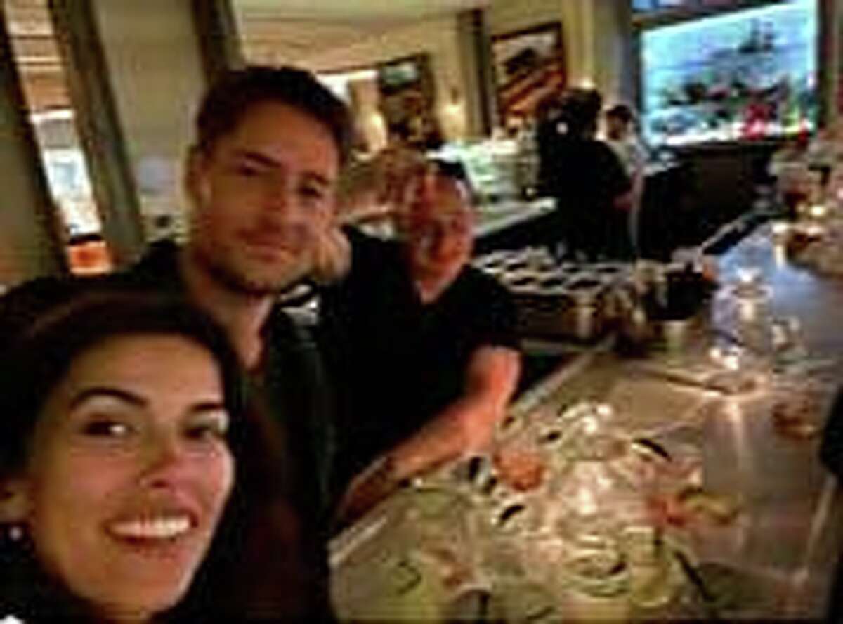 “This is Us” star Justin Hartley and his wife, Sofia Pernas, chat with Sal LoBalbo of LoBalbo Auto Body in Stamford at Eastend restaurant on Greenwich Avenue last month.