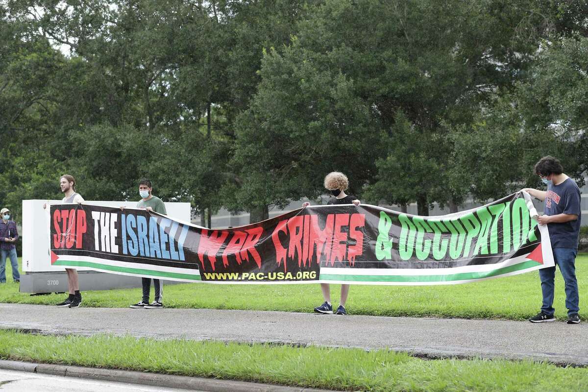 Protesters hold signs in front of the Boeing Company Saturday, June 5, 2021, in Houston. Houstonians gathered at Boeing to commemorate the 54th anniversary of the continued mass expulsion of Palestinians that occurred in 1967 at the hands of Israeli forces, also known as the Naksa (“setback”), and to demonstrate against Boeing’s new plan to sell $735 million worth of precision guided missiles to Israel amidst the recent acts of violence by the state of Israel against Palestinians.