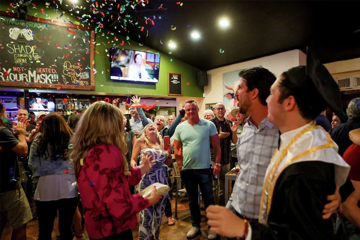 Confetti fills the air at Backyard on Broadway, 2411 Broadway St., when it appears District 1 runoff candidate Mario Bravo (second from right) has won the runoff election with incumbent Roberto Trevino on Saturday, June 5, 2021. Bravo defeated Trevino by 539 votes with 53.58% of the total votes cast.