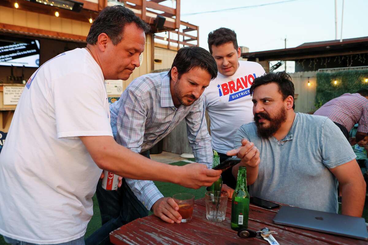 District 1 runoff candidate Mario Bravo, second from left, watches as the first election day votes are posted with senior policy advisor Tomas Larralde, from left, Anthony Cruz and Bert Santibanez,at his election night party at Backyard on Broadway, 2411 Broadway St., on Saturday, June 5, 2021. Bravo defeated incumbent Roberto Trevino by 539 votes with 53.58% of the total votes cast.