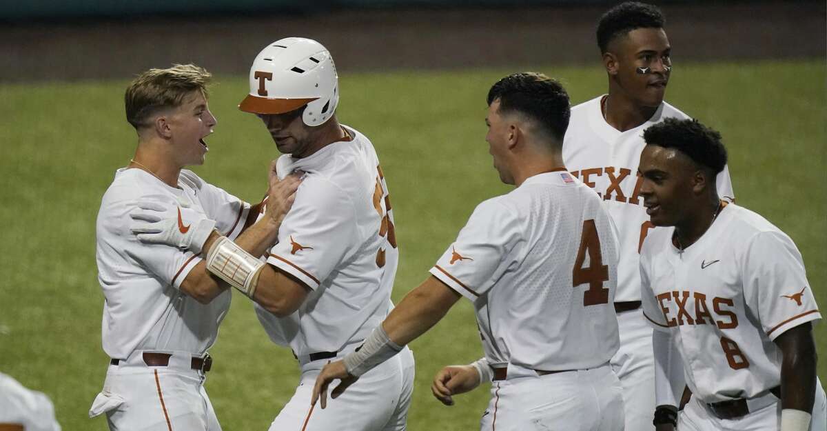 Texas' Zach Zubia, second from left, celebrates with teammates after hitting a two-run home run against Arizona State in the fourth inning of an NCAA college baseball tournament regional game Saturday, June 5, 2021, in Austin, Texas. (AP Photo/Eric Gay)
