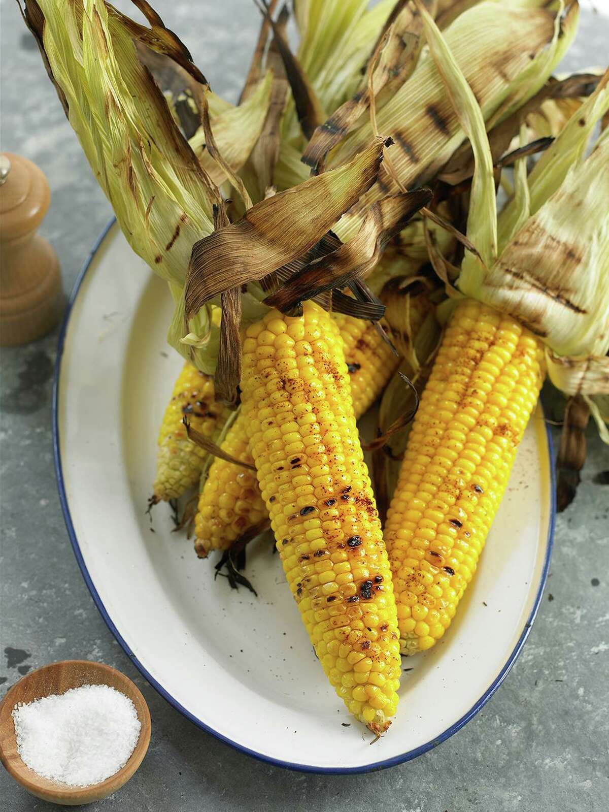 For the best flavor, grill whole ears of sweet corn with the husks on for about 20 minutes over medium heat.