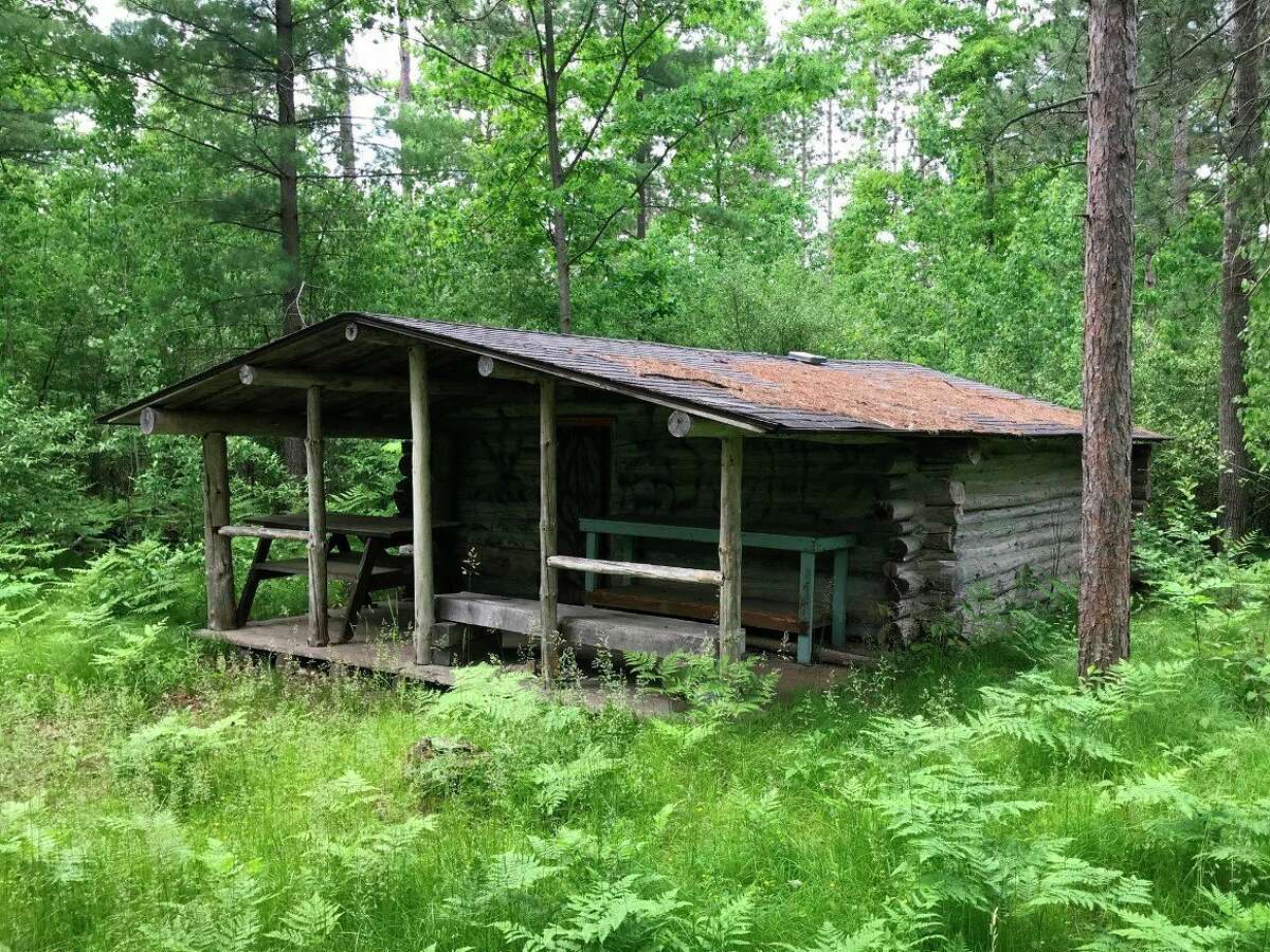 The Mecosta County Parks Commission has determined that the facilities, including this log cabin, at the White Pine Valley Recreation Area are not safe for visitors to the camping area. They are requesting that the area be closed to camping. (Photo courtesy of the Parks Commission)