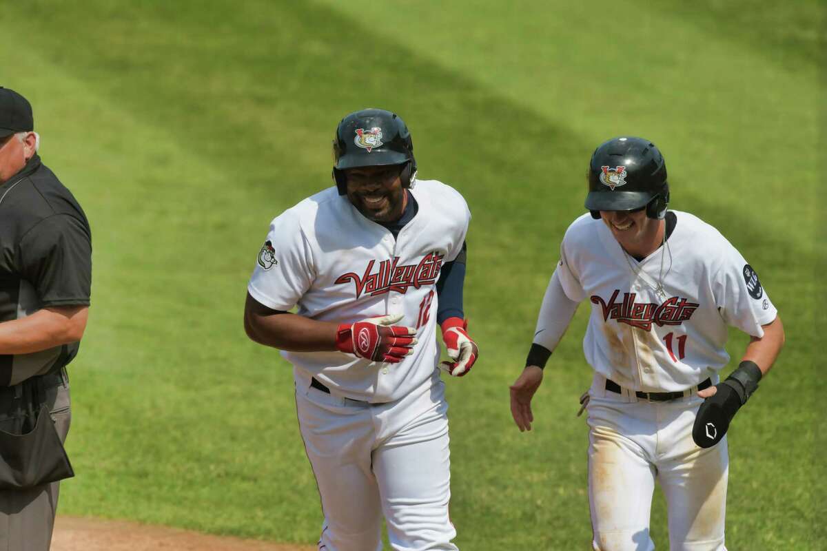 Denis Phipps, left, and Carson Maxwell are all smiles after Phipps hit a home run in their game against New Jersey on Sunday, June 6, 2021, in Troy, N.Y. (Paul Buckowski/Times Union)