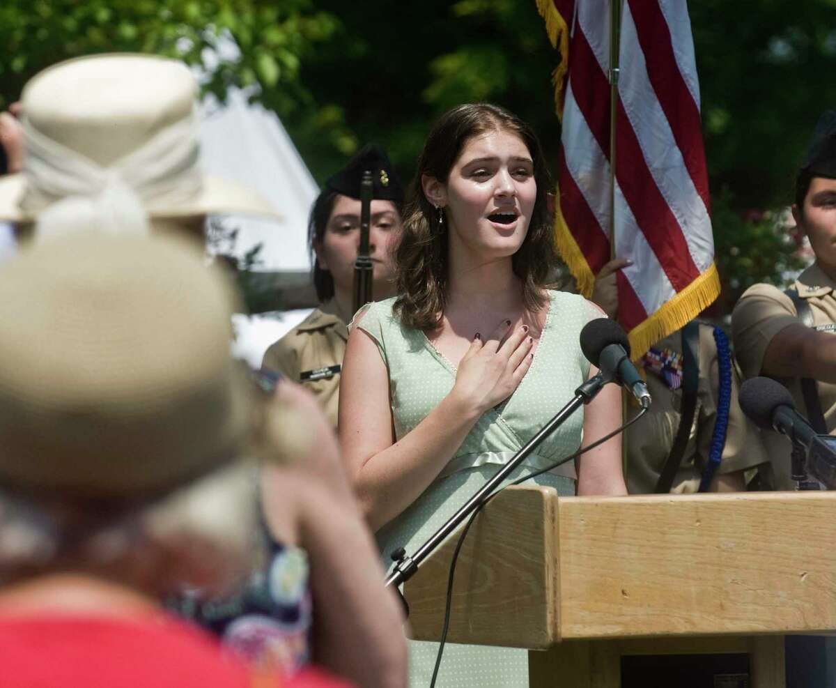 Soloist Konstantina Gotoudidis, of the Crystal Theater in Norwalk, sings the National Anthem at the re-dedication ceremony of the newly refurbished Nathan Hale statue at Fodor Farm. Sunday, June 6, 2021