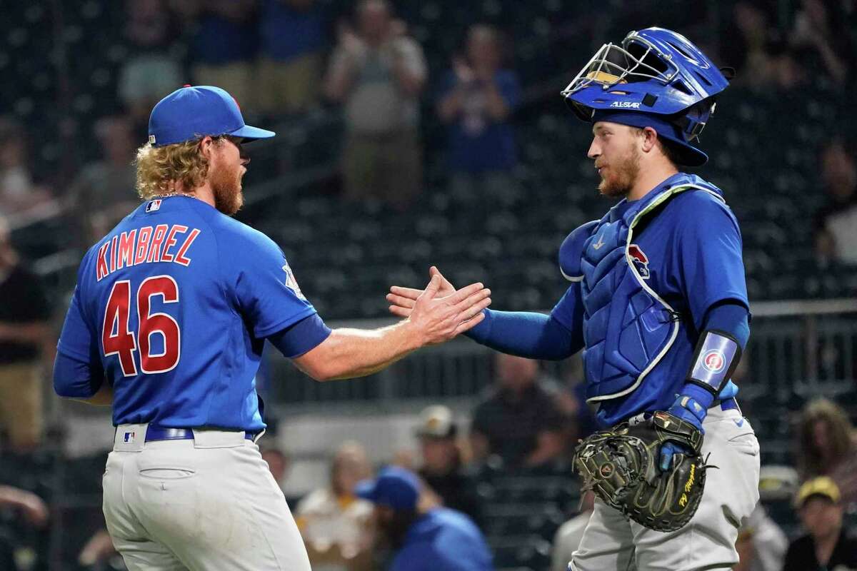 Chicago Cubs relief pitcher Craig Kimbrel (46) is greeted by catcher P.J. Higgins after the team's 4-3 over the Pittsburgh Pirates in a baseball game Tuesday, May 25, 2021, in Pittsburgh. (AP Photo/Keith Srakocic)