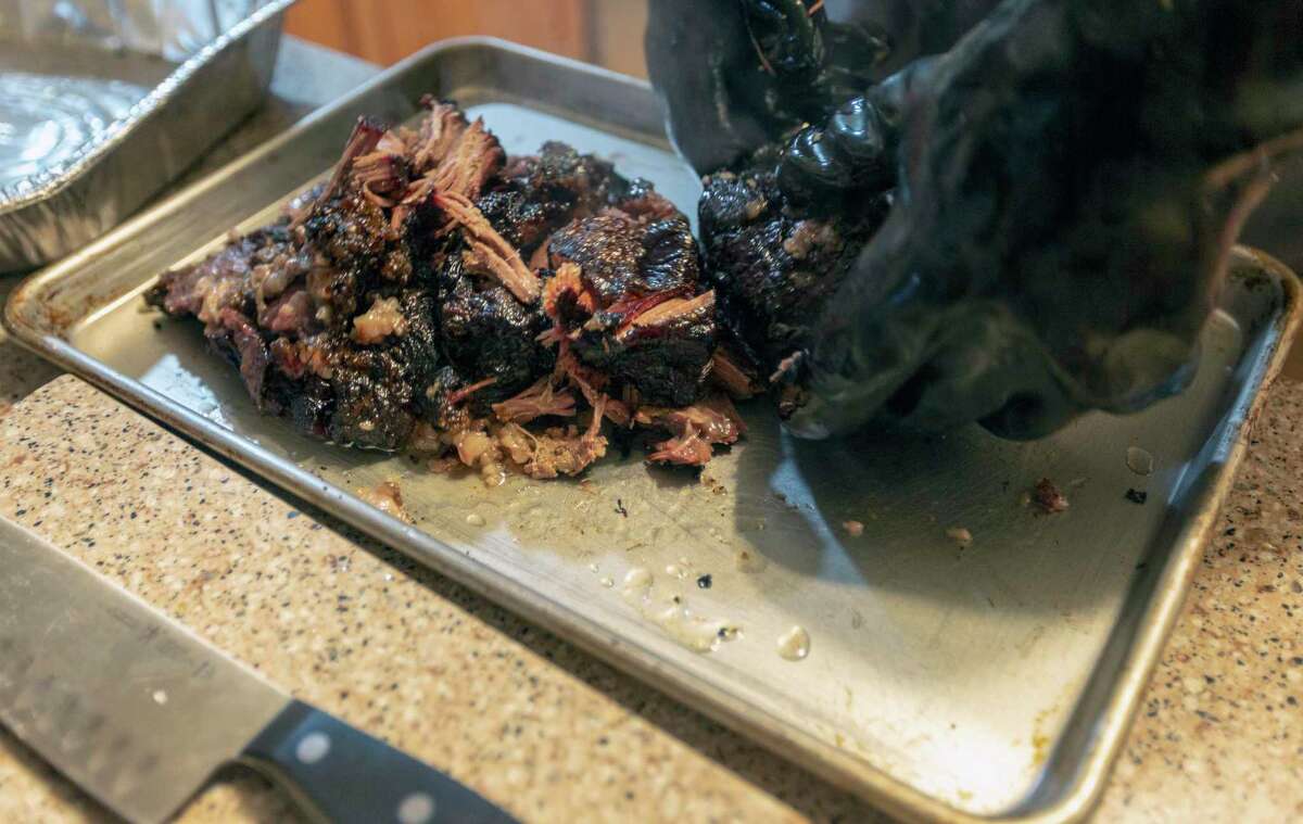 Finished smoked beef cheeks can be easily shredded by hand for tacos.