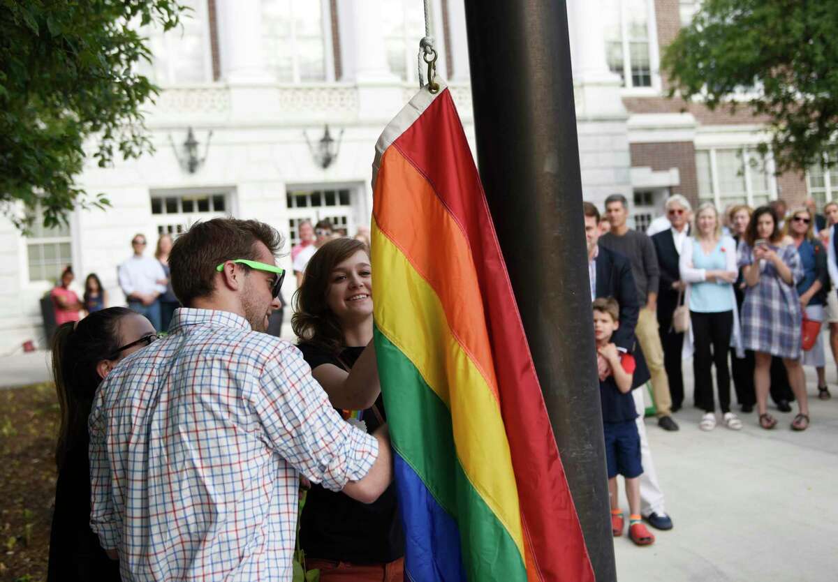Photos from the LGBT flag raising ceremony at Town Hall in Greenwich, Conn. Monday, June 13, 2016. A crowd of more than 100 gathered for the ceremony to honor the victims killed in the shooting at Pulse, a gay Orlando nightclub.