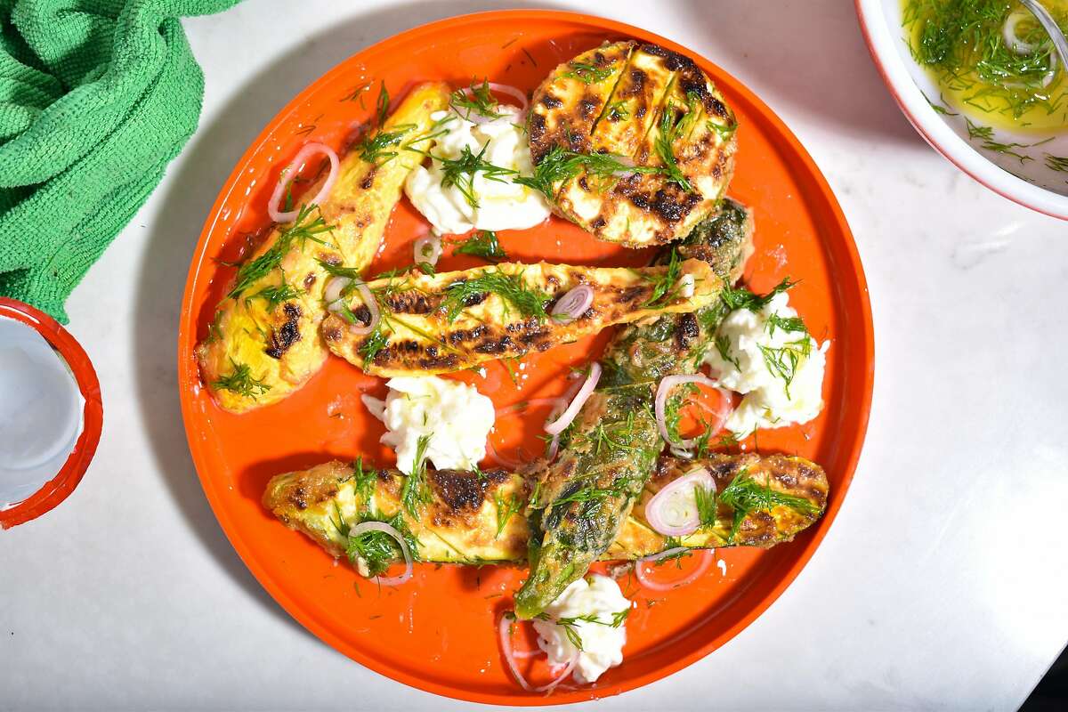 This dish is a spin-off of a classic caprese salad, using tahini-marinated broiled squash, burrata and lemon.