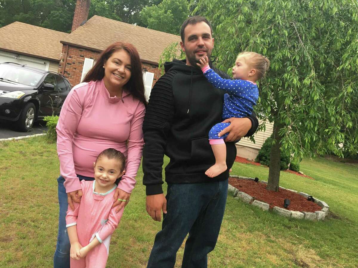 The Teixeiras -- Elizabeth, left, Luis, Skyler, 18 months, and Avery, 4, of West Haven on Thursday, June 3, 2021.